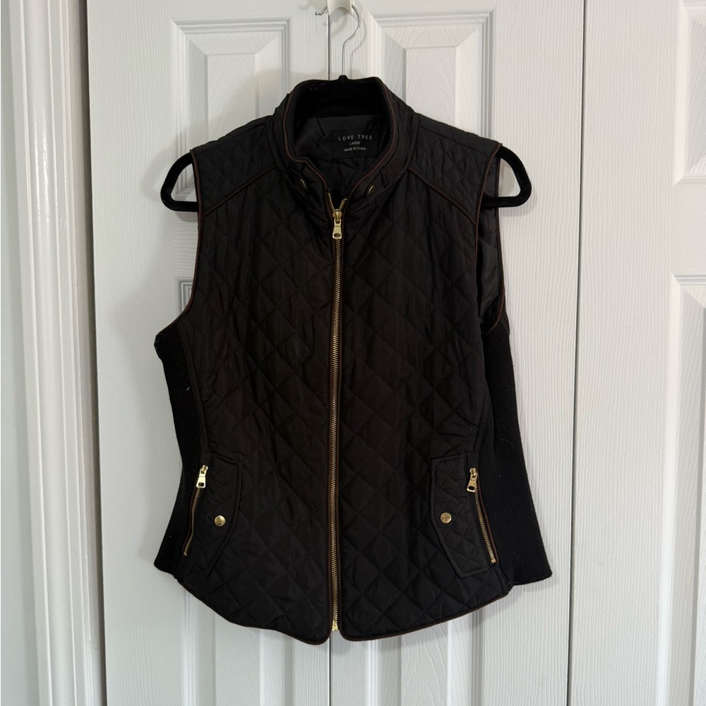 Large black vest with gold zipper